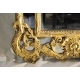 Miroir style Louis XV en bois sculpté