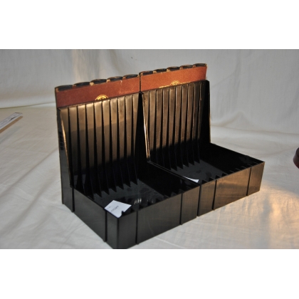 Red faux-book CD holder at  Moinat SA  - Antiques and home décor