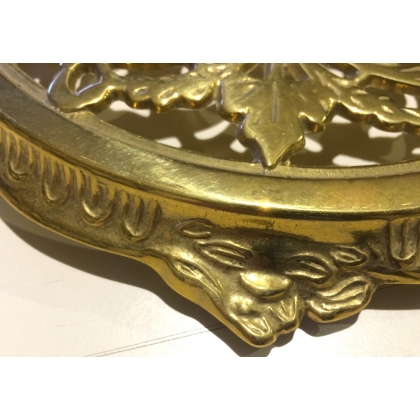 Round polished brass trivet from  Moinat SA  - Antiques and home décor
