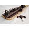 Wall-mounted corkscrew made of cast iron and wood at  Moinat SA  - Antiques and home décor