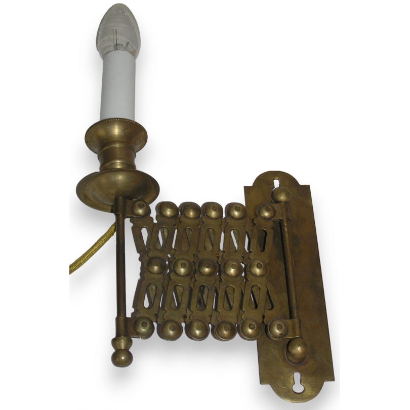 Extendable wall light, made of brass. Available from  Moinat SA  - Antiques and home décor