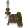 Extendable wall light, made of brass. Available from  Moinat SA  - Antiques and home décor