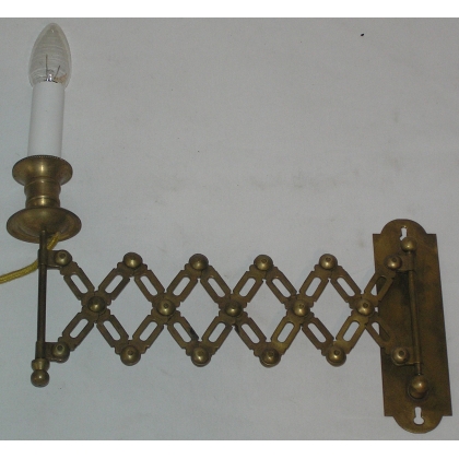 Extendable wall light, made of brass. Available from  Moinat SA  - Antiques and home décor