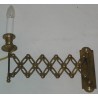 Extendable wall light, made of brass. Available from  Moinat SA  - Antiques and home décor