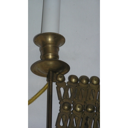 Extendable wall light, made of brass. Available from  Moinat SA  - Antiques and home décor