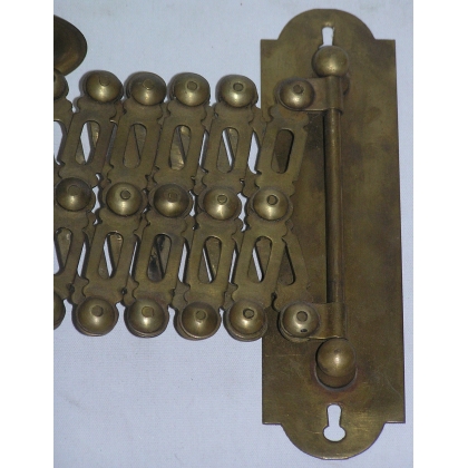Extendable wall light, made of brass. Available from  Moinat SA  - Antiques and home décor