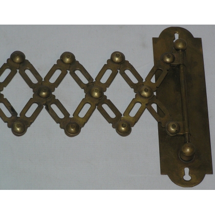 Extendable wall light, made of brass. Available from  Moinat SA  - Antiques and home décor
