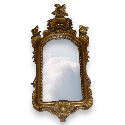  Miroir italien en bois sculpté et doré sur  Moinat SA  - Antiquités décoration