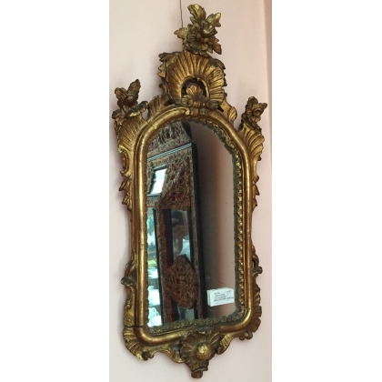  Miroir italien en bois sculpté et doré sur  Moinat SA  - Antiquités décoration