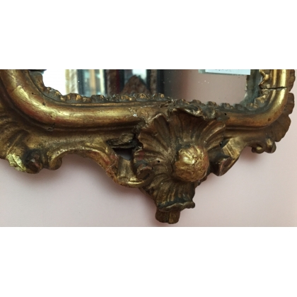  Miroir italien en bois sculpté et doré sur  Moinat SA  - Antiquités décoration