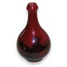  Vase miniature en porcelaine rouge sur  Moinat SA  - Antiquités décoration