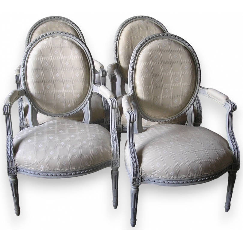 Set of 4 Louis XVI armchairs with medallion motifs. Available from Moinat SA – Antiques and home décor