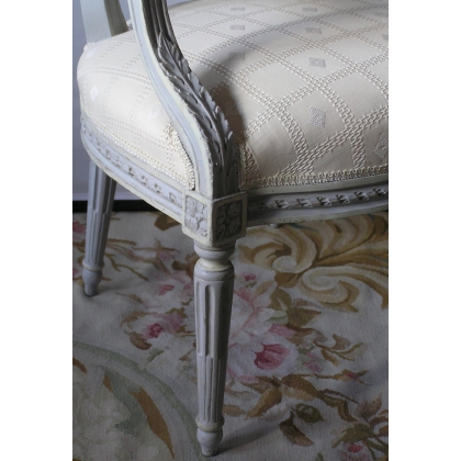 Set of 4 Louis XVI armchairs with medallion motifs. Available from Moinat SA – Antiques and home décor