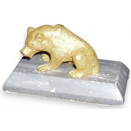 Gilt bear on rectangular gray marble.