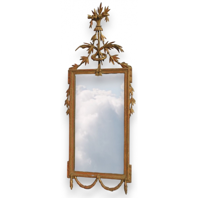 Miroir Louis XVI, en bois doré décapé.