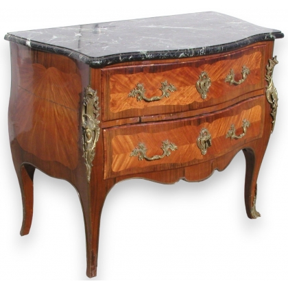 Louis XV commode with bronze ornaments.