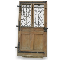 Entrance door decorated with wrought iron.