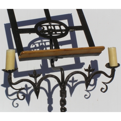 Wrought-iron candlestick. With 2 candles. At  Moinat SA  – Antiques and home décor