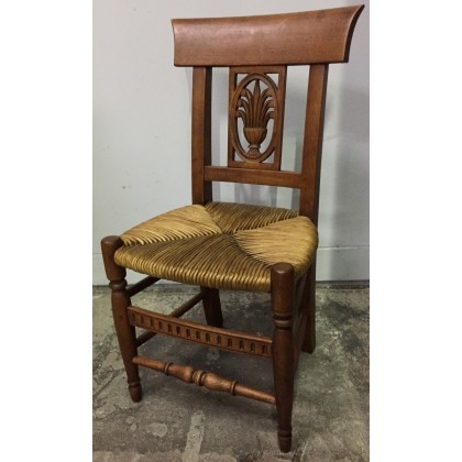 Children’s chair with straw seat and carved backrest. From  Moinat SA  – Antiques and home décor