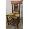 Children’s chair with straw seat and carved backrest. From  Moinat SA  – Antiques and home décor
