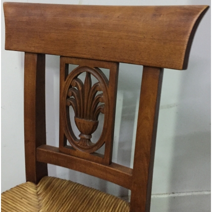 Children’s chair with straw seat and carved backrest. From  Moinat SA  – Antiques and home décor