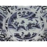 Round plate from DELFT. Decorated with figures. Available from  Moinat SA  - Antiques and home décor