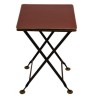  Table pliante en tôle rouge et filet or sur  Moinat SA  - Antiquités décoration