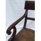 Paire de fauteuils, en acajou. Assise en cuir brun