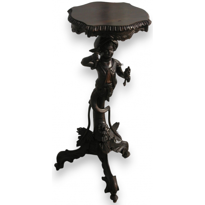 Baroque-style side table with Venetian candlestick holder. Available from Moinat SA – Antiques and home décor
