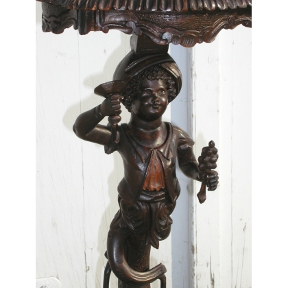 Baroque-style side table with Venetian candlestick holder. Available from Moinat SA – Antiques and home décor