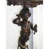 Baroque-style side table with Venetian candlestick holder. Available from Moinat SA – Antiques and home décor