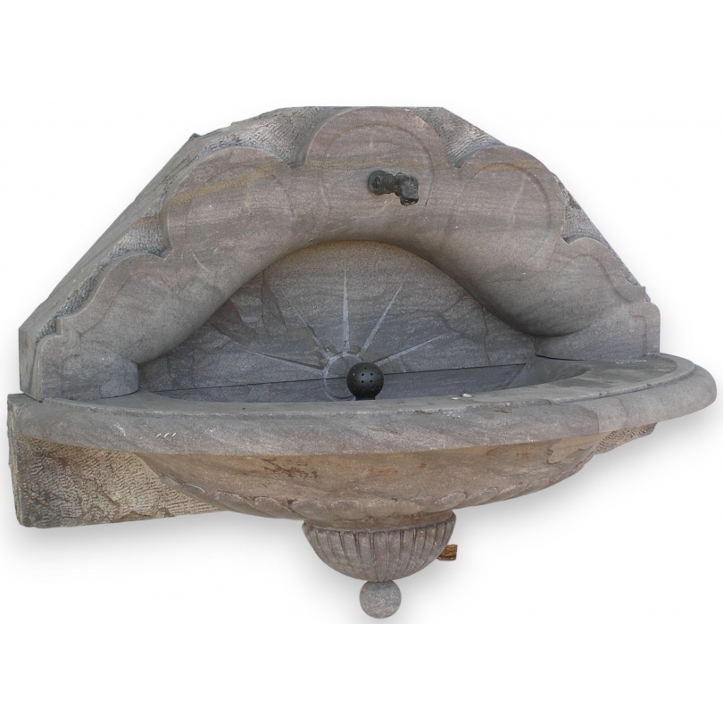 Half-moon wall fountain, made of Sous-Vent stone. Available from Moinat SA – Antiques and Decor