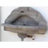 Half-moon wall fountain, made of Sous-Vent stone. Available from Moinat SA – Antiques and Decor