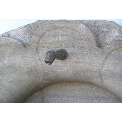 Half-moon wall fountain, made of Sous-Vent stone. Available from Moinat SA – Antiques and Decor
