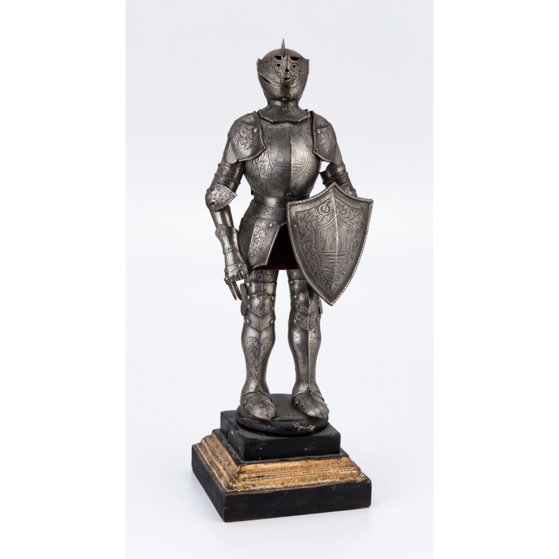 Model reduces to a neo-gothic a medieval armor
