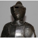 Model reduces to a neo-gothic a medieval armor