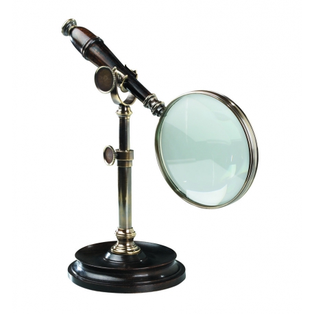 Wooden-handled magnifying glass with a patinated brass stand at Moinat SA – Antiques and home décor