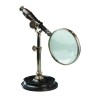 Wooden-handled magnifying glass with a patinated brass stand at Moinat SA – Antiques and home décor