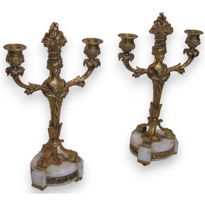 Pair of Louis XVI candlesticks with white marble bases. From  Moinat SA  – Antiques and home décor