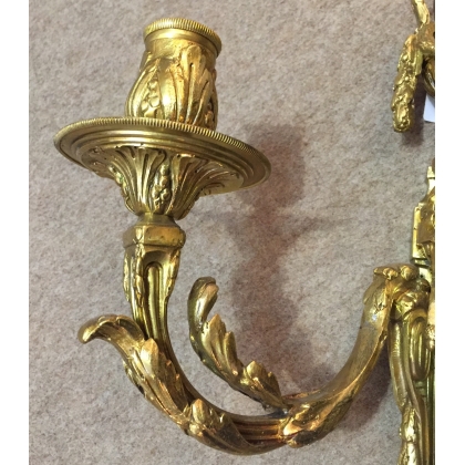 Pair of Louis XVI wall lights with three bulbs. From Moinat SA – Antiques and home décor