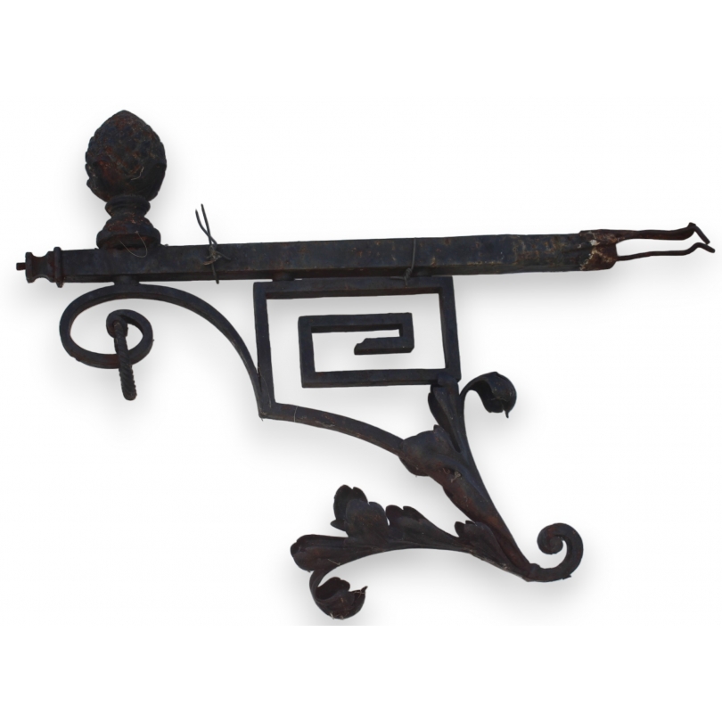 Cast-iron candlestick topped with a pine cone at  Moinat SA  - Antiques and home décor