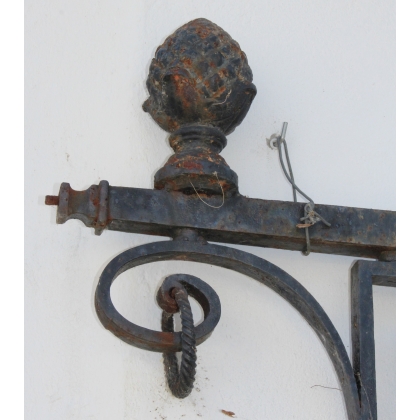 Cast-iron candlestick topped with a pine cone at  Moinat SA  - Antiques and home décor