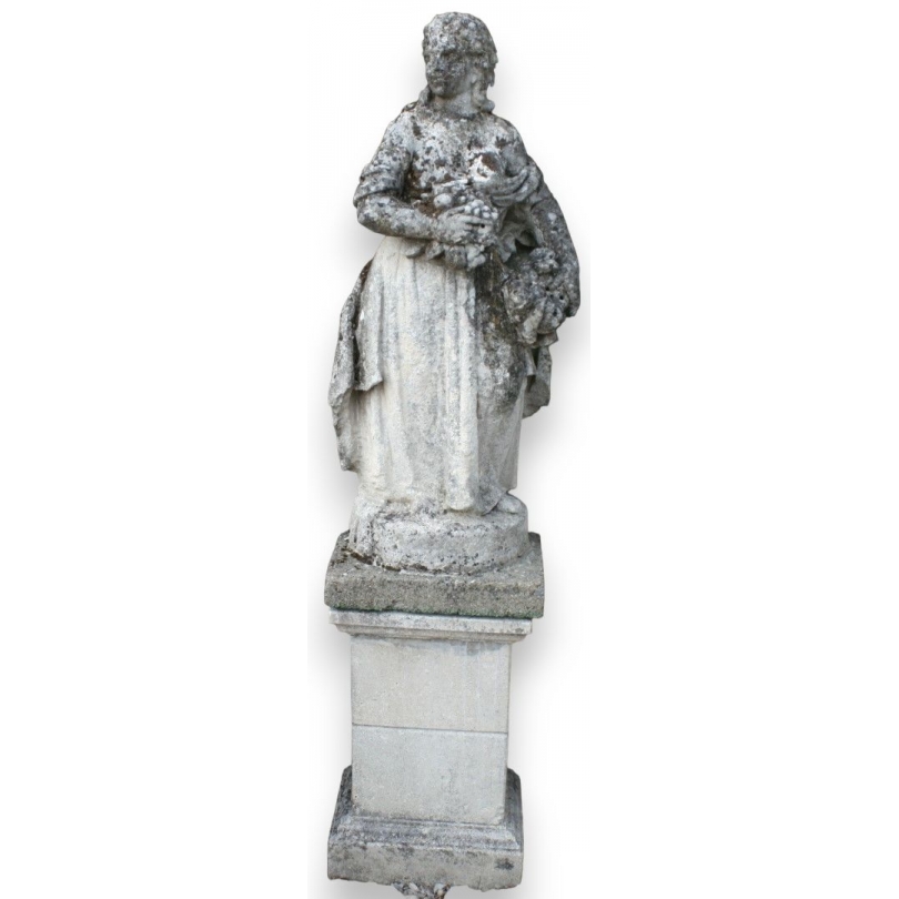  Sculpture "Femme aux fruits" en pierre de Vicenza sur  Moinat SA  - Antiquités décoration