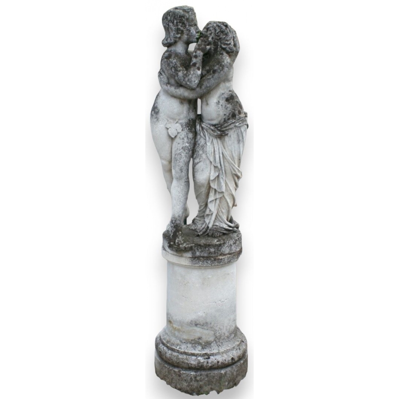 Stone sculpture entitled ‘Les Amours’, on a round plinth, by Moinat SA – Antiques and Decor