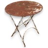  Table en fer forgé ronde pliante sur  Moinat SA  - Antiquités décoration