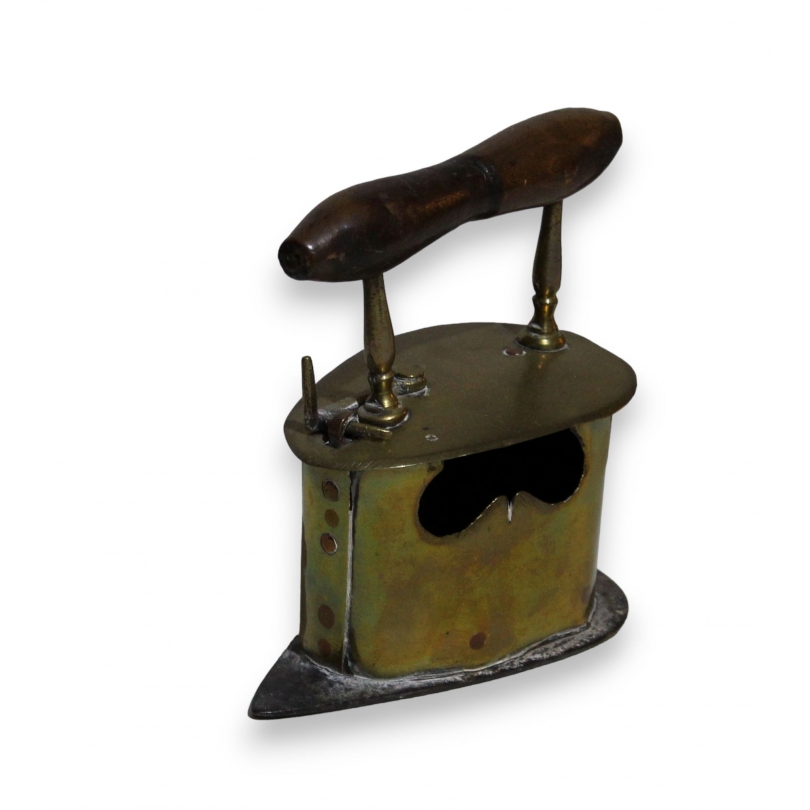 Iron made of brass, copper and iron