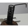 Coiled iron candle holder with a wooden base