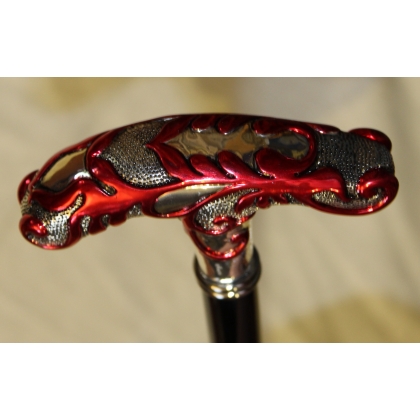 Walking stick with a silver handle decorated with red