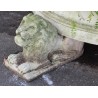 A half-moon-shaped basin resting on three lions