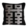 Cushion with a silver geometric pattern on a black background